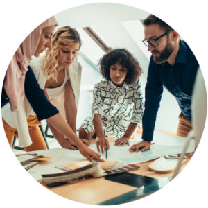 Group of co-workers looking at paperwork